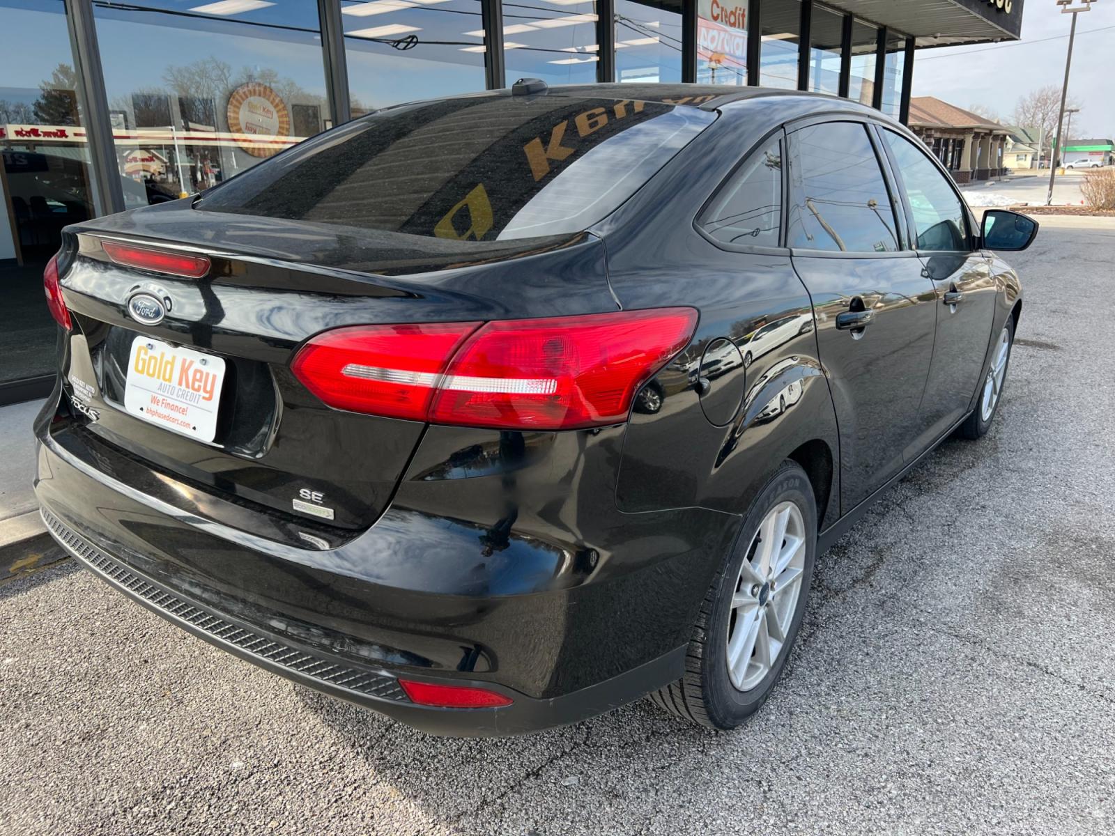 2018 Shadow Black Ford Focus SEDAN 4-DR (1FADP3FE7JL) with an 1.0L L3 engine, located at 1633 W Kimberly, Davenport, IA, 52806, (563) 323-5341, 41.559456, -90.598732 - Photo #3